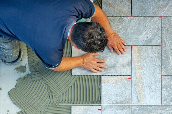 Tiler,Carefully,Lays,Every,Single,Tile,With,The,Help,Of